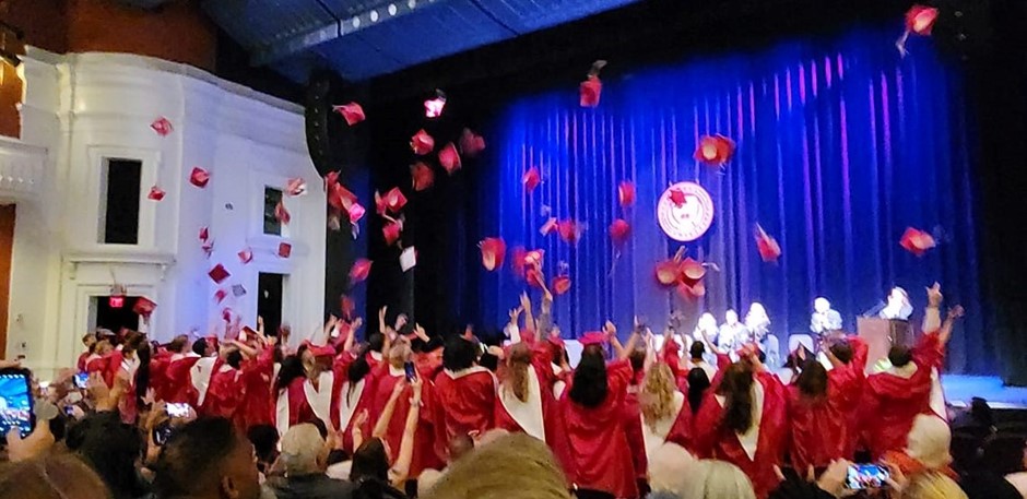 Graduates throwing caps